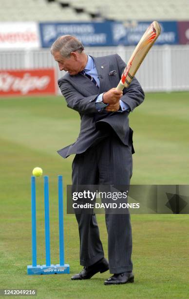 Britain's Prince Charles faces England bowlers Ashley Giles and Sajid Mahmood during a visit to the Prince's Trust 12 week cricketing programme at...