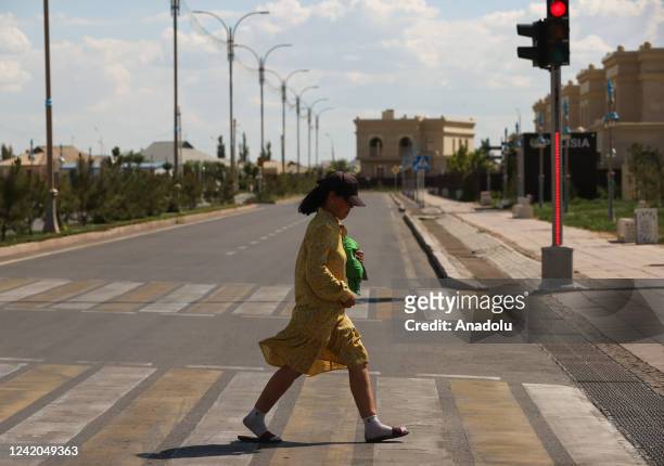 Pedestrian cross the street in Almaty, Kazakhstan on July 20, 2022.
