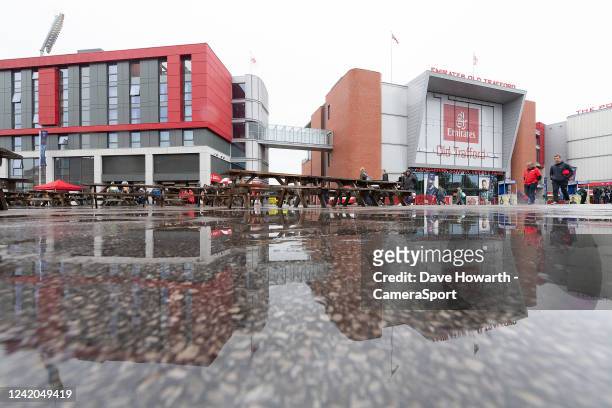 The fans arrive to a wet start to the game at Old Trafford before the Royal London Series 3rd ODI between England and South Africa at Headingley on...