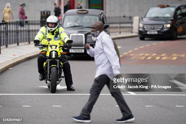 West Midlands police officer with an all-electric Harley Davidson 'LiveWire' motorcycle by New Street station, Birmingham, ahead of the commonwealth...