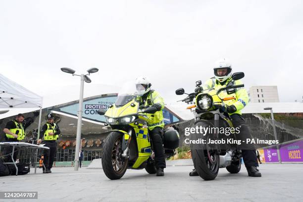 West Midlands police officers with two all-electric Harley Davidson 'LiveWire' motorcycles ride by New Street station, Birmingham, ahead of the...