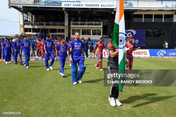 Shikhar Dhawan of India leads his team onto the field for the national anthem ceremony during the 1st ODI match between West Indies and India at...