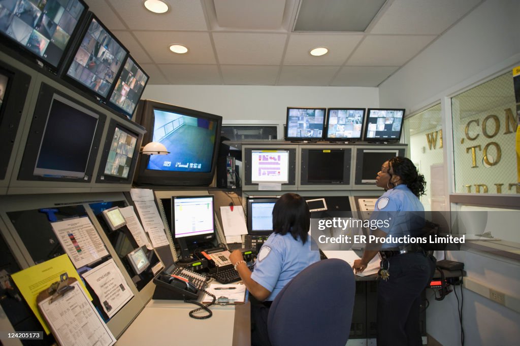 African American security guards working in control room