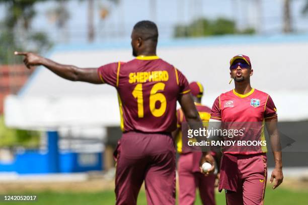 Nicholas Pooran sets the field for Romario Shepherd of West Indies during the 1st ODI match between West Indies and India at Queens Park Oval, Port...