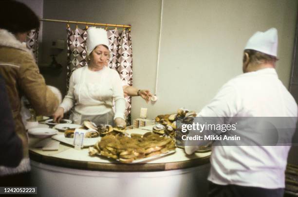 Waitress sells desserts from stand in Brest, currently in Belarus, in November 1983.