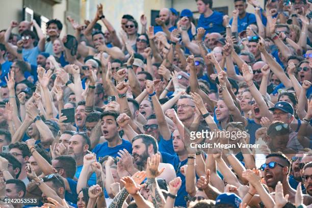 The crowd of supporters for the blue team, Santa Croce, cheer as two opposing teams from two of the four historical neighborhoods in Florence, face...