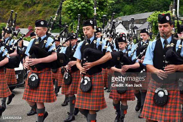 Pipers of Oban High School Pipe Band as they lead the Chieftain's Parade at the start of Tobermory highland games, on July 21 in Tobermory, Scotland.