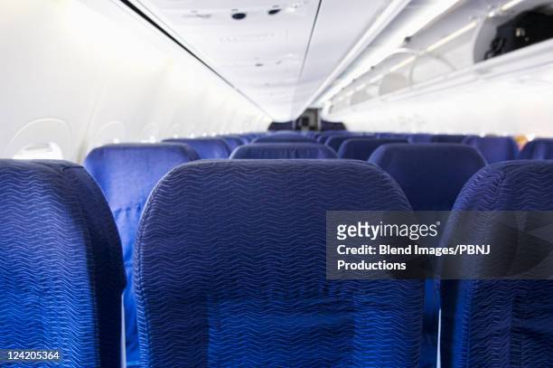 empty airplane cabin - seat stock pictures, royalty-free photos & images
