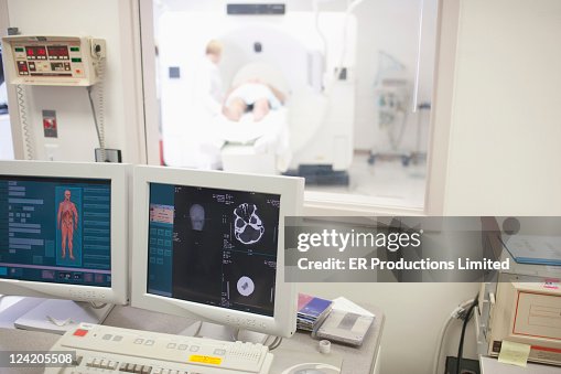 Mri Scan Computer Computer Monitors With Mri Scanner In Background High-Res Stock Photo ...