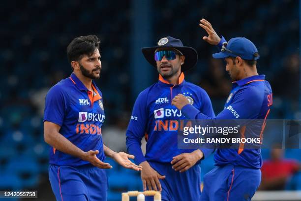 Shardul Thakur and Shikhar Dhawan of India celebrate the dismissal of Sharmarh Brooks of West Indies during the 1st ODI match between West Indies and...
