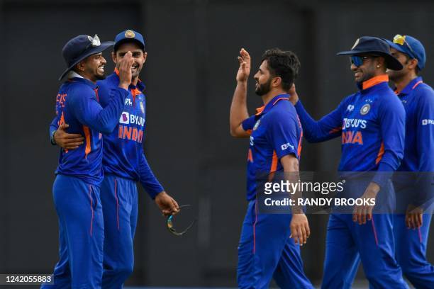 Shreyas Iyer , Shardul Thakur and Shikhar Dhawan of India celebrate the dismissal of Sharmarh Brooks of West Indies during the 1st ODI match between...