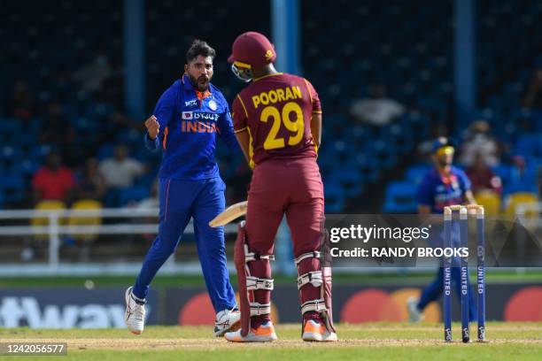 Mohammed Siraj of India celebrates the dismissal of Nicholas Pooran of West Indies during the 1st ODI match between West Indies and India at Queens...