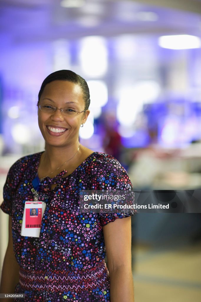 African American nurse standing in hospital