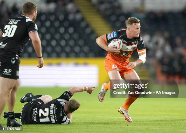 Castleford Tigers' Adam Milner gets past the tackle of Hull FC's Jordan Johnstone during the Betfred Super League match at MKM Stadium, Hull. Picture...