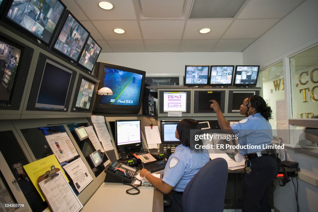 African American security guards working in control room
