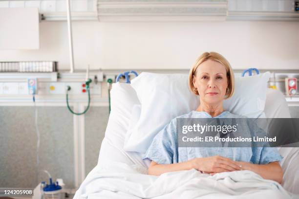 caucasian patient laying in hospital bed - hospital bed stock pictures, royalty-free photos & images