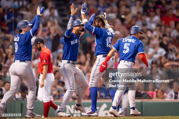 Raimel Tapia of the Toronto Blue Jays reacts after hitting an inside-the-park grand slam during the third inning of a game against the Boston Red Sox...