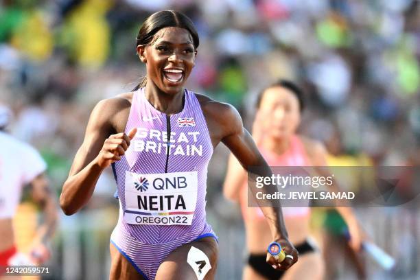 Britain's Daryll Neita crosses the finish line to win a heat of the women's 4x100m relay during the World Athletics Championships at Hayward Field in...