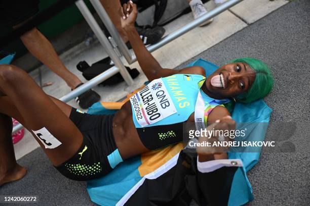 Bahamas' Shaunae Miller-Uibo lies on the track as she celebrates after winning the women's 400m final during the World Athletics Championships at...