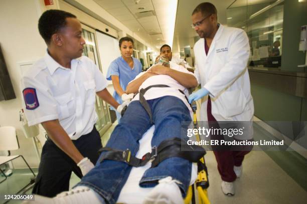 medics transporting patient to hospital - ambulance arrival stock pictures, royalty-free photos & images