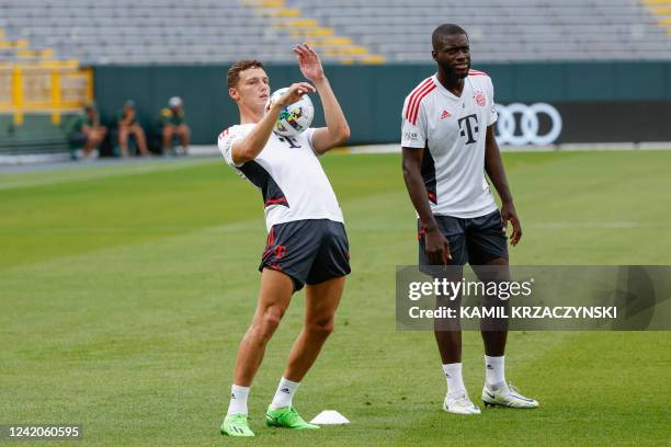 Bayern Munich defender Benjamin Pavard plays with the ball during a training session ahead of friendly pre-season match against Manchester City FC at...