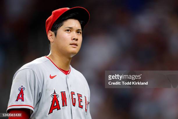 Shohei Ohtani of the Los Angeles Angels reacts after being pulled from the game during the seventh inning against the Atlanta Braves at Truist Park...
