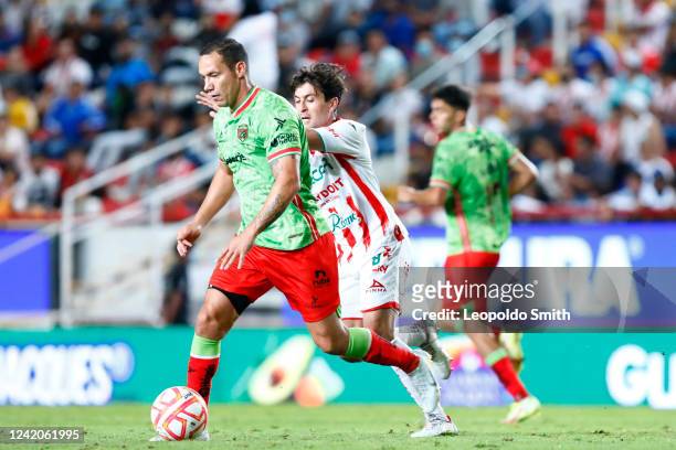 Jesus Duenas of FC Juarez struggles for the ball with Fernando Madrigal of Necaxa during the 4th round match between Necaxa and FC Juarez as part of...