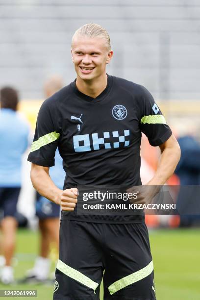 Manchester City FC forward Erling Haaland warms up during a training session ahead of friendly pre-season match against FC Bayern Munich at Lambeau...