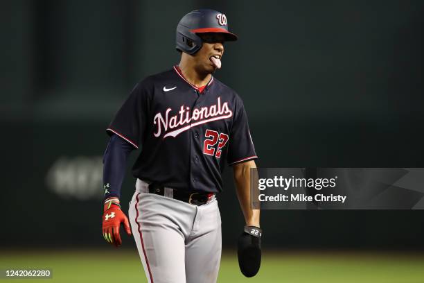 Juan Soto of the Washington Nationals reacts on the base path during the MLB game against the Arizona Diamondbacks at Chase Field on July 22, 2022 in...