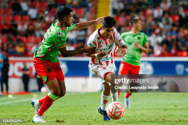 Brayan Garnica of Necaxa struggles for the ball with Matias Garcia of FC Juarez during the 4th round match between Necaxa and FC Juarez as part of...