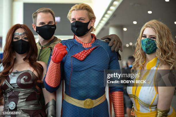 Cosplayers portray characters from Amazon show "The Boys" in the lobby of the convention center during Comic-Con International 2022 on July 22, 2022...