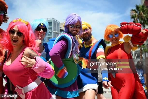 Colorful cosplayers pose outside the convention center during Comic-Con International 2022 on July 22, 2022 in San Diego, California.