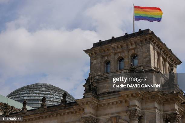 The rainbow flag is raised on the roof of the Reichstag, the building housing the German lower House of Parliament, for the first time ahead of the...