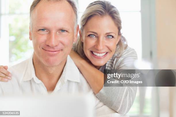 portrait of a happy mature couple smiling - 40 49 years stock pictures, royalty-free photos & images