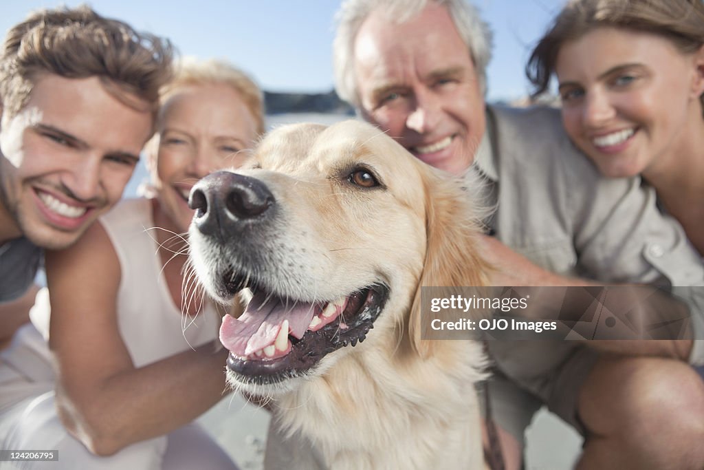 Portrait of a happy family with pet dog