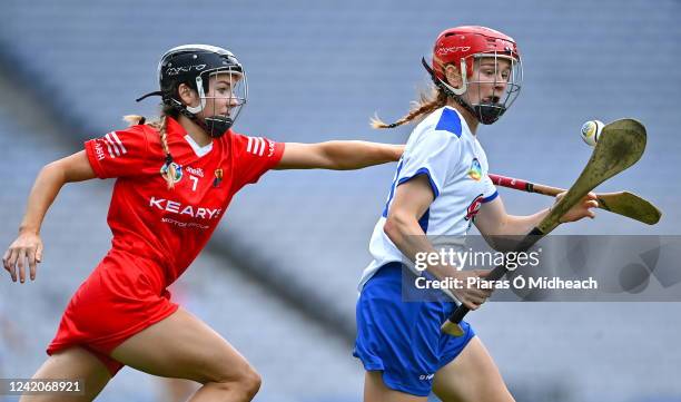 Dublin , Ireland - 23 July 2022; Beth Carton of Waterford in action against Saoirse McCarthy of Cork during the Glen Dimplex Senior Camogie...