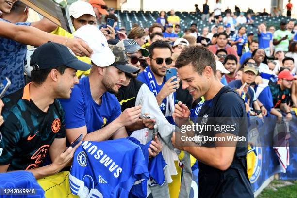 César Azpilicueta of Chelsea sign autographs and pose for pictures before a training session at Osceola Heritage Park Orlando FC Training Facility on...