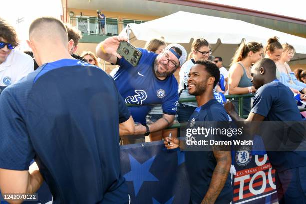 Raheem Sterling of Chelsea sign autographs and pose for pictures before a training session at Osceola Heritage Park Orlando FC Training Facility on...
