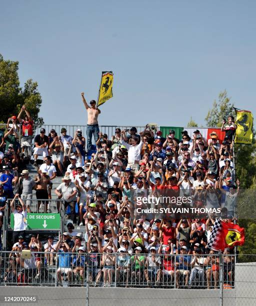Ferrari supporters waves flags during the qualifying session ahead of the French Formula One Grand Prix at the Circuit Paul Ricard in Le Castellet,...