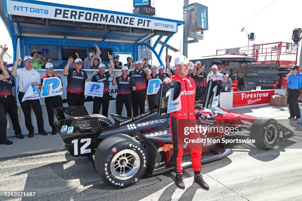 IndyCar series driver Will Power poses for a photo with his team after wining the pole award for both the HY-VEE DEALS.COM 250 and the HY-VEE Salute...