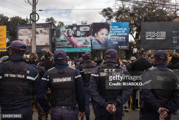 Madagascar police watch over opposition supporters close to former President Marc Ravalomanana as they attempt to gather for a protest in downtown...