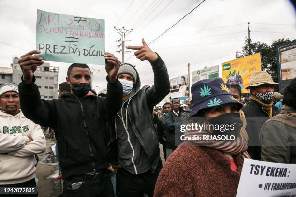 Opposition supporters close to former President Marc Ravalomanana gesture as they attempt to gather for a protest in downtown Antananarivo on July...