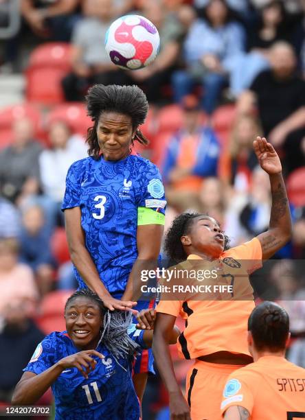 France's defender Wendie Renard and Netherlands' striker Lineth Beerensteyn vie for a header during the UEFA Women's Euro 2022 quarter final football...