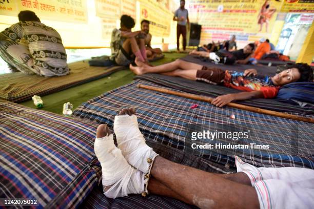 Kanwariyas resting at camp during Kanwar yatra ahead of Shivratri Festival, at Akshardham, on July 23, 2022 in New Delhi, India.