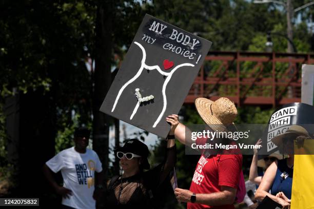 Protestors march and chant in Downtown Atlanta, in opposition to Georgia's new abortion law on July 23, 2022 in Atlanta, Georgia. A federal appeals...