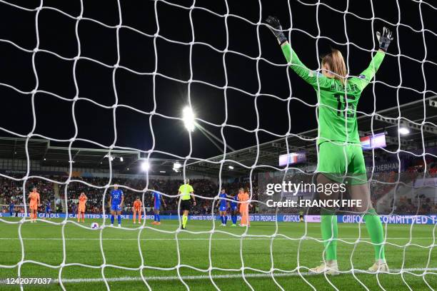 Netherlands' goalkeeper Daphne van Domselaar gets ready as France's defender Eve Perisset prepares to shoot a penalty kick during the UEFA Women's...