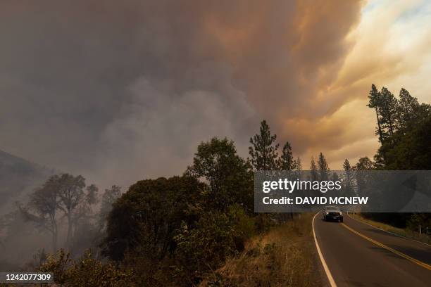 Destroyed property is left in its wake as the Oak Fire chews through the forest near Midpines, northeast of Mariposa, California, on July 23, 2022....