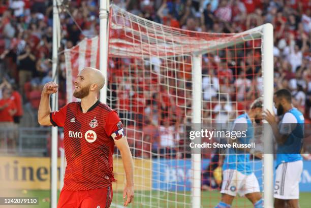 Toronto FC midfielder Michael Bradley tips the ball over Charlotte FC goalkeeper Kristijan Kahlina to score his second of the game as Toronto FC...