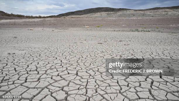 Buoys that read 'No Boats' lay on cracked dry earth where water once was at Lake Mead, Nevada on July 23, 2022. Water levels in Lake Mead are at the...