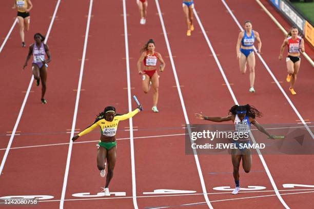 S Twanisha Terry crosses the finish line to win the women's 4x100m relay final during the World Athletics Championships at Hayward Field in Eugene,...